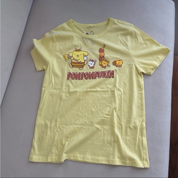 Sanrio Tops - SANRIO POMPOMPURIN YELLOW GRAPHIC
T-SHIRT JUNIOR SIZE XS NWT